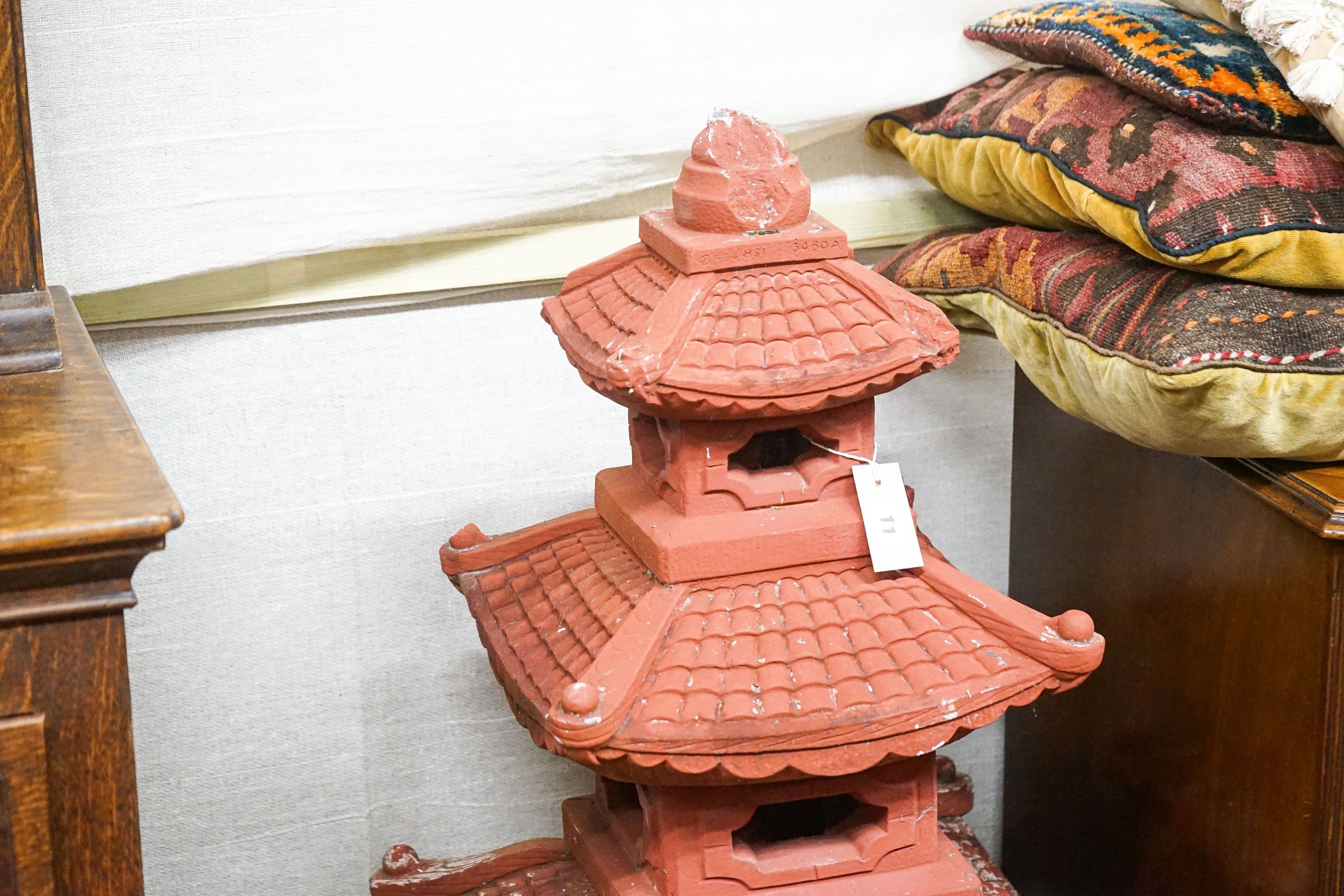 A painted reconstituted stone sectional pagoda garden ornament, height 104cm